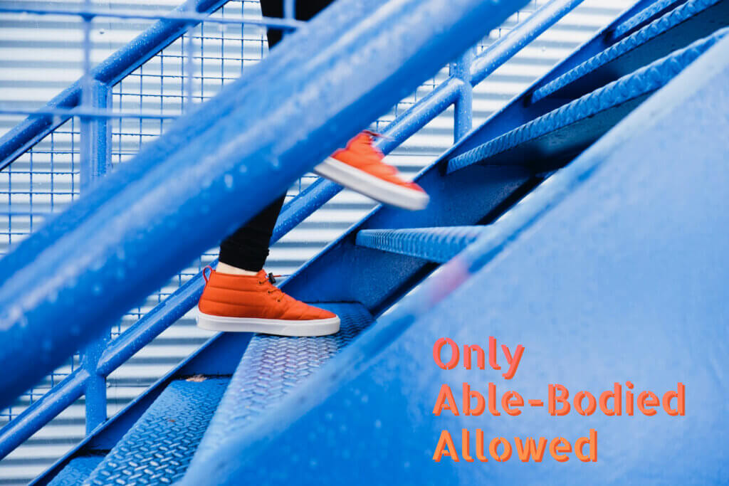 A blue staircase with a person stepping up the steps in orange shoes, with the words “Only Able-Bodied Allowed” on the right.